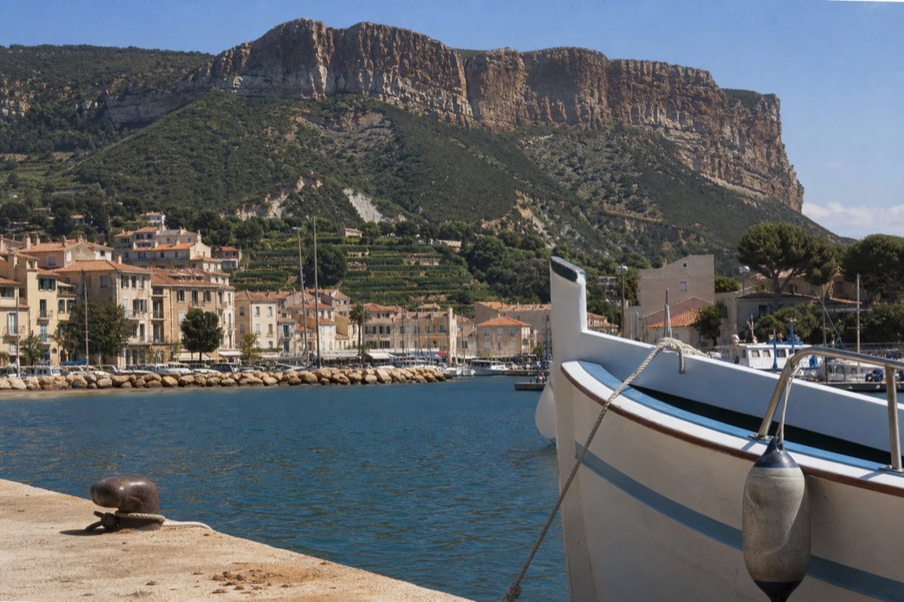 White limestone cliffs above the vineyards and harbour of Cassis, no text, no logos, no people